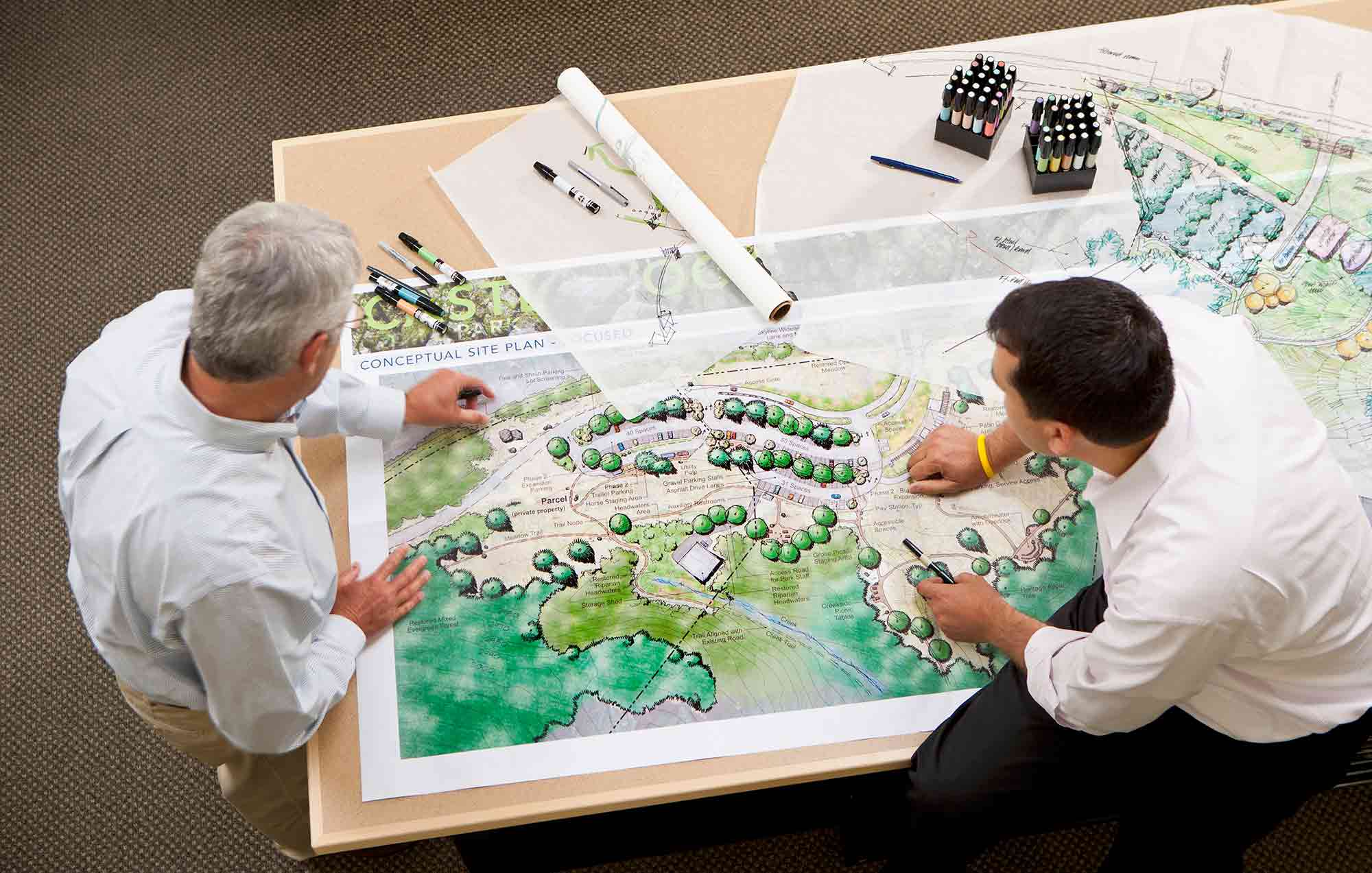 Two design professionals at work in an office Urban planning