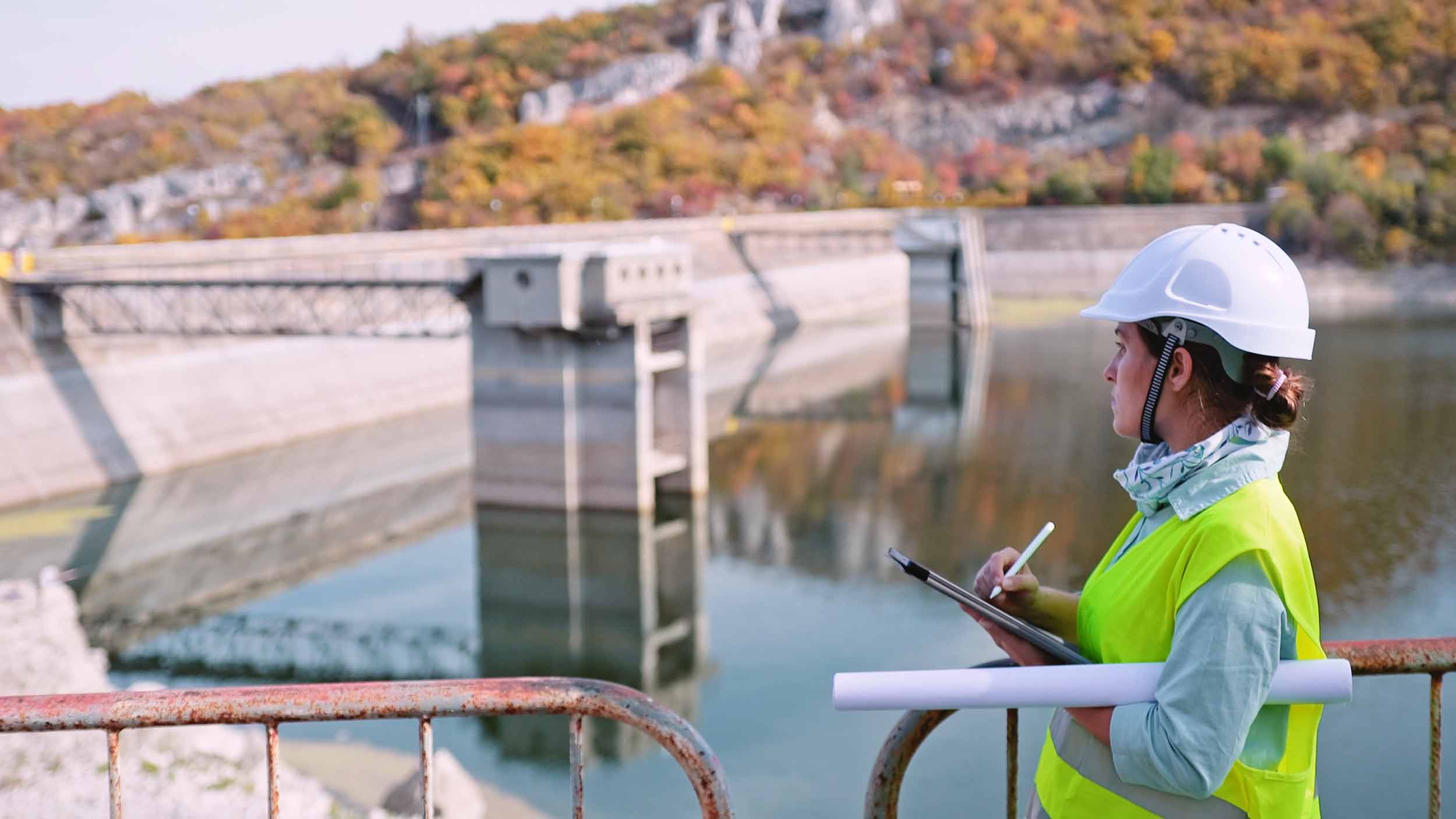 resource_management_hero a resource manager inspecting a river dam