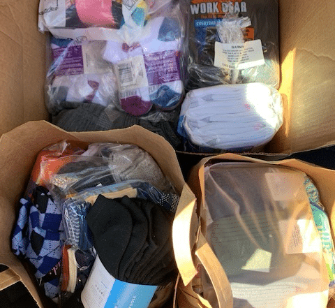 multiple bags of socks donated for Socktober