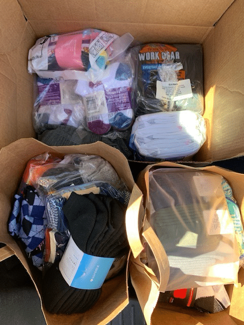multiple bags of socks donated for Socktober